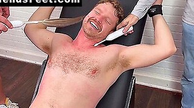 Russ Laughs Hard While His Doms Dan And Girth Tickle His Big Feet